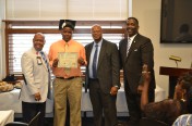 Principal Hubart, Dr. Tayor and Ron Turner Congratulate Jakari Davis